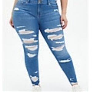 Torrid Jeggings super soft medium wash with destruct hem